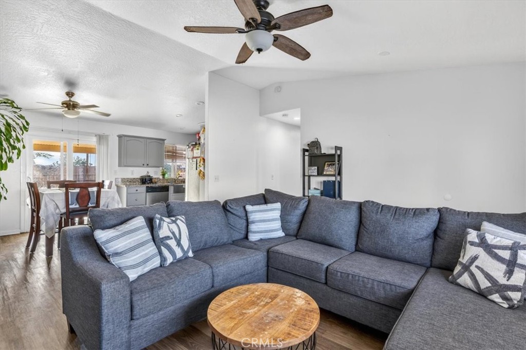 13146 Mohawk Road Apple Valley, CA 92308 - Photo 3 of 15 a living room with furniture