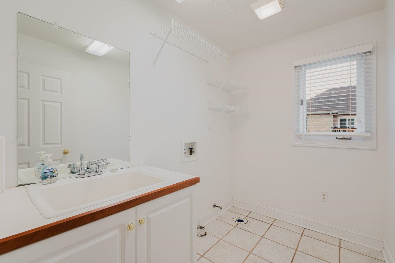 3881 Davis Road Penn Laird, VA 22846 - Photo 26 of 75 a bathroom with a sink and a mirror