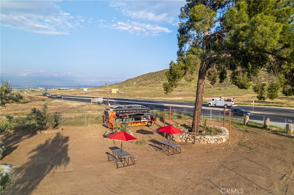 26220 Calvert Avenue Hemet, CA 92545 - Photo 16 of 69 a view of swimming pool with a table and chairs in patio