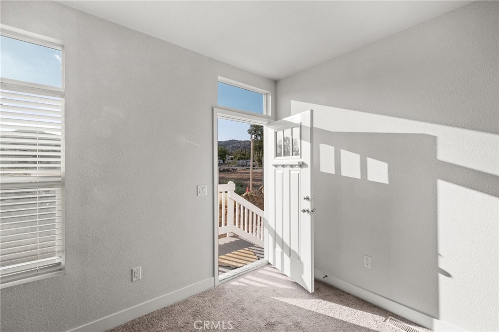 26220 Calvert Avenue Hemet, CA 92545 - Photo 23 of 69 a view of a hallway with windows