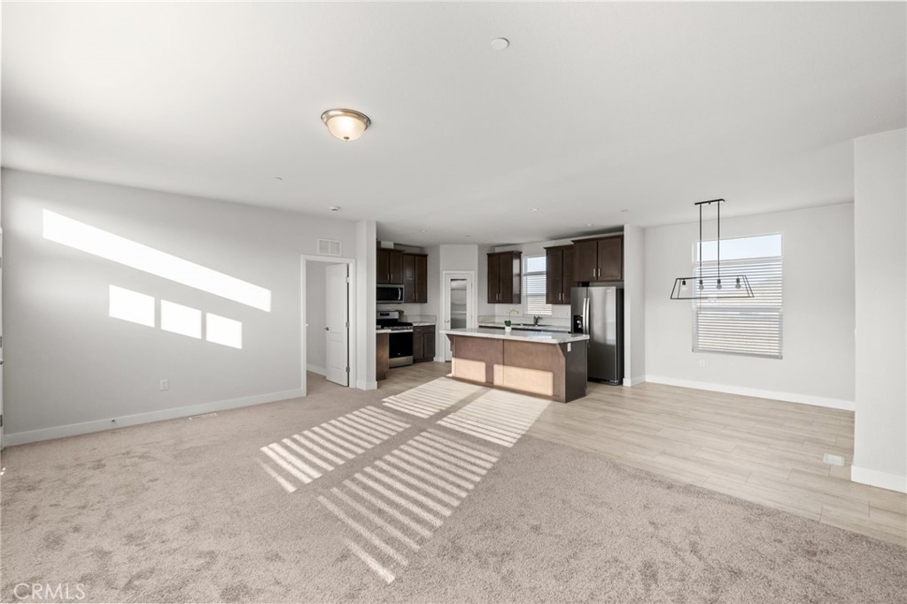 26220 Calvert Avenue Hemet, CA 92545 - Photo 26 of 69 a view of kitchen with furniture and refrigerator