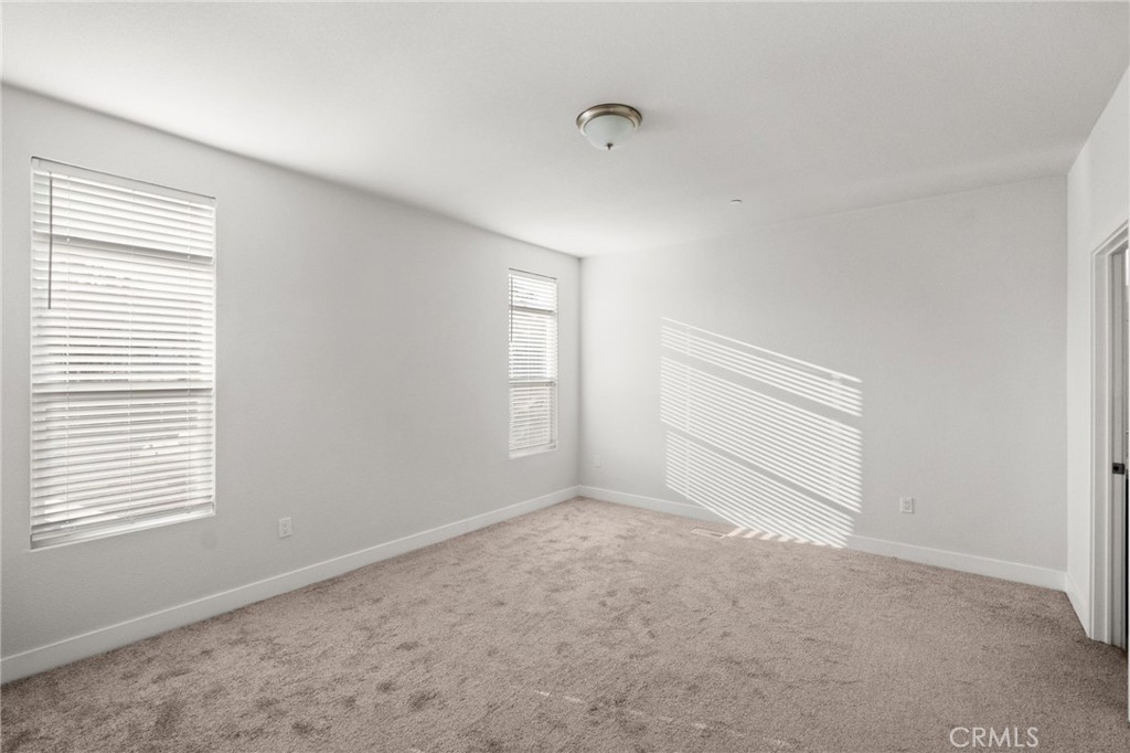 26220 Calvert Avenue Hemet, CA 92545 - Photo 34 of 69 an empty room with windows