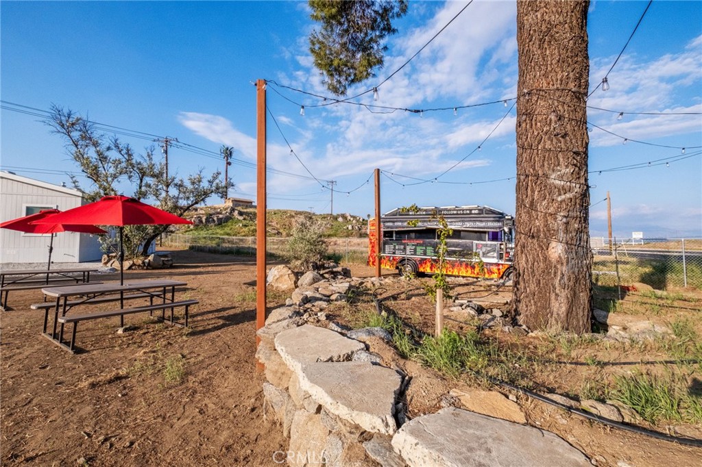 26220 Calvert Avenue Hemet, CA 92545 - Photo 45 of 69 a view of a terrace with wooden floor