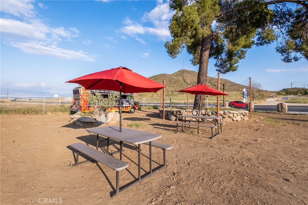26220 Calvert Avenue Hemet, CA 92545 - Photo 47 of 69 an outdoor space with patio and outdoor seating