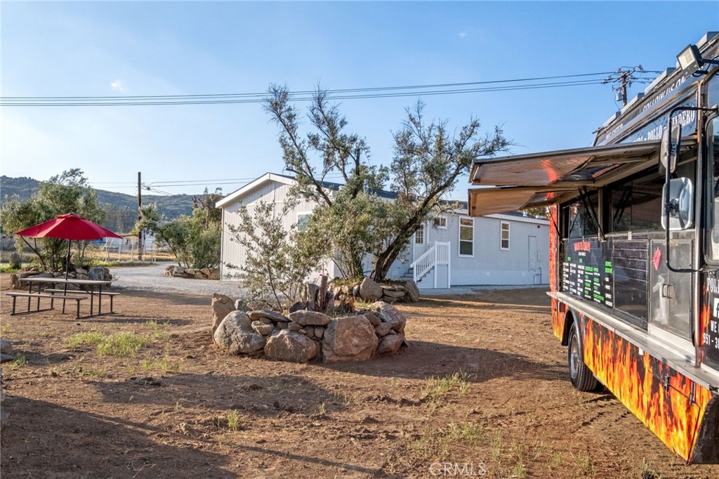 26220 Calvert Avenue Hemet, CA 92545 - Photo 53 of 69 a view of a house with wooden fence