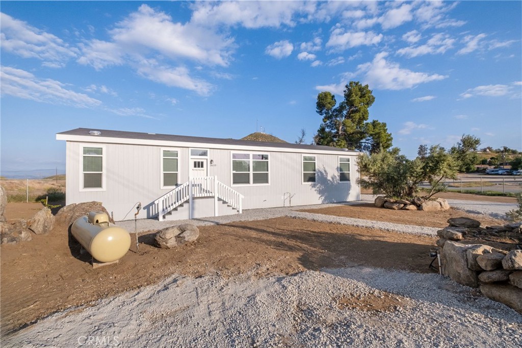 26220 Calvert Avenue Hemet, CA 92545 - Photo 67 of 69 a front view of a house with a garden