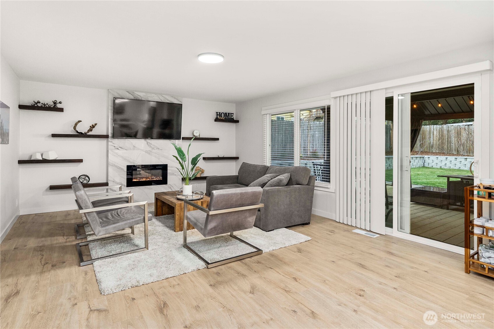 622 South 150th Street Burien, WA 98148 - Photo 12 of 25 a living room with furniture a fireplace and a flat screen tv