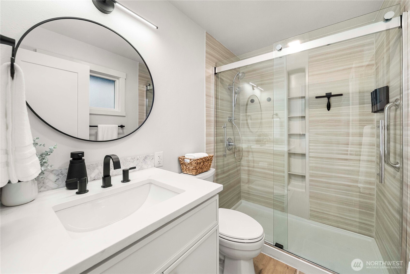 622 South 150th Street Burien, WA 98148 - Photo 16 of 25 a bathroom with a sink a toilet and a mirror