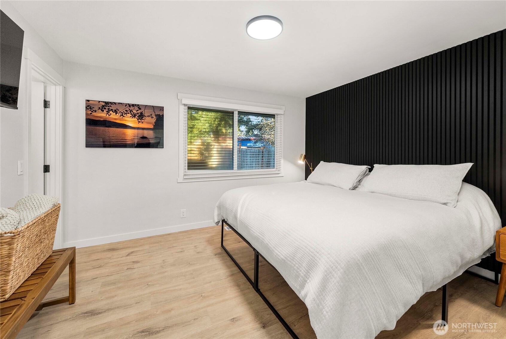 622 South 150th Street Burien, WA 98148 - Photo 19 of 25 a bedroom with a bed and a flat screen tv