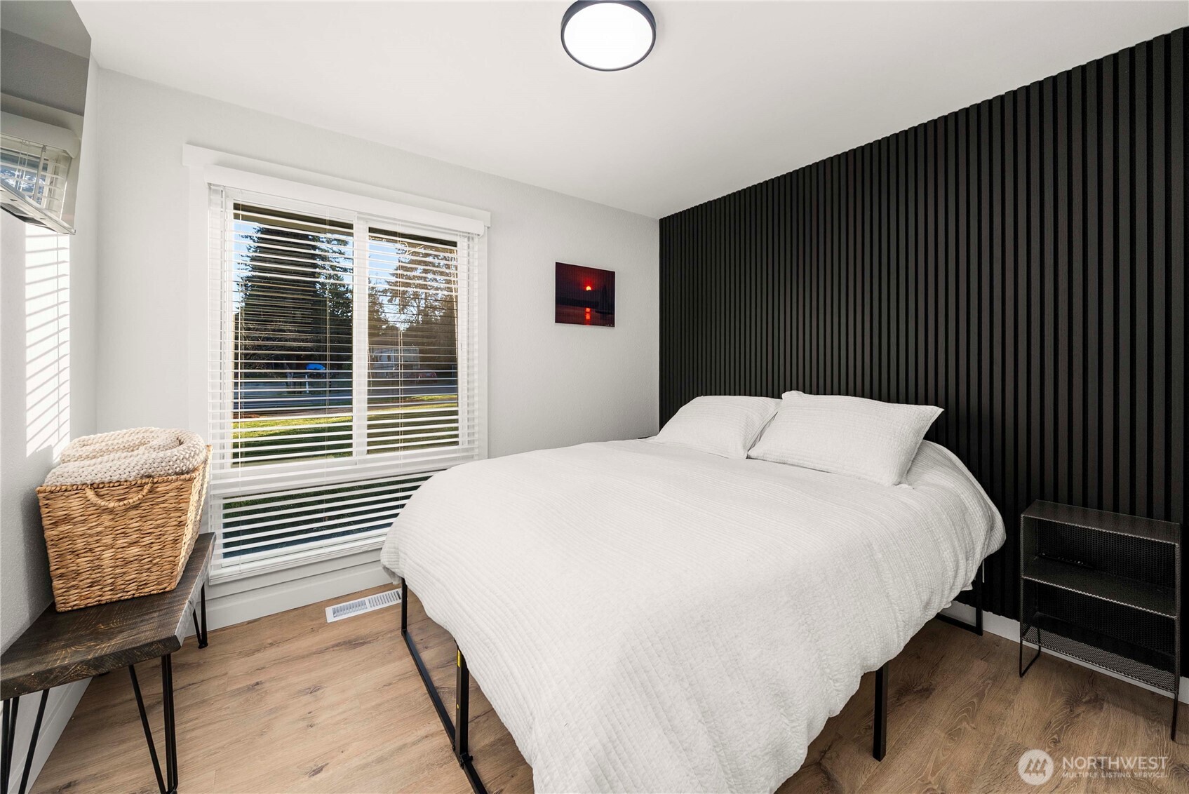 622 South 150th Street Burien, WA 98148 - Photo 21 of 25 a bedroom with a bed and chair with the outer view