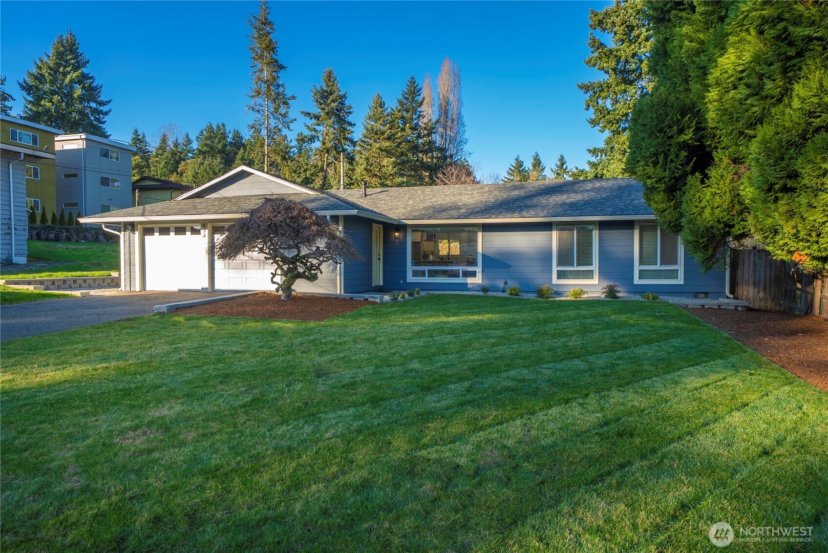 622 South 150th Street Burien, WA 98148 - Photo 22 of 25 a front view of house with yard and green space