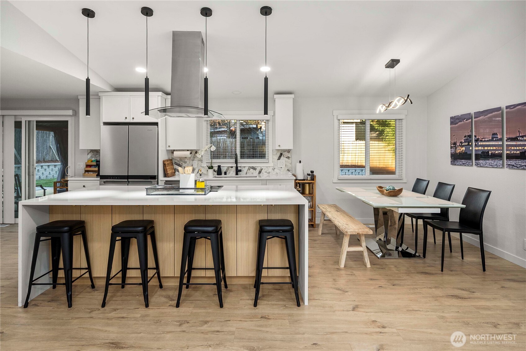 622 South 150th Street Burien, WA 98148 - Photo 5 of 25 a dining hall with stainless steel appliances kitchen island granite countertop a dining table chairs and granite counter tops