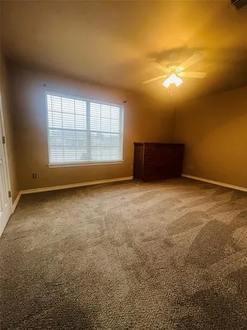 an empty room with a empty space and windows