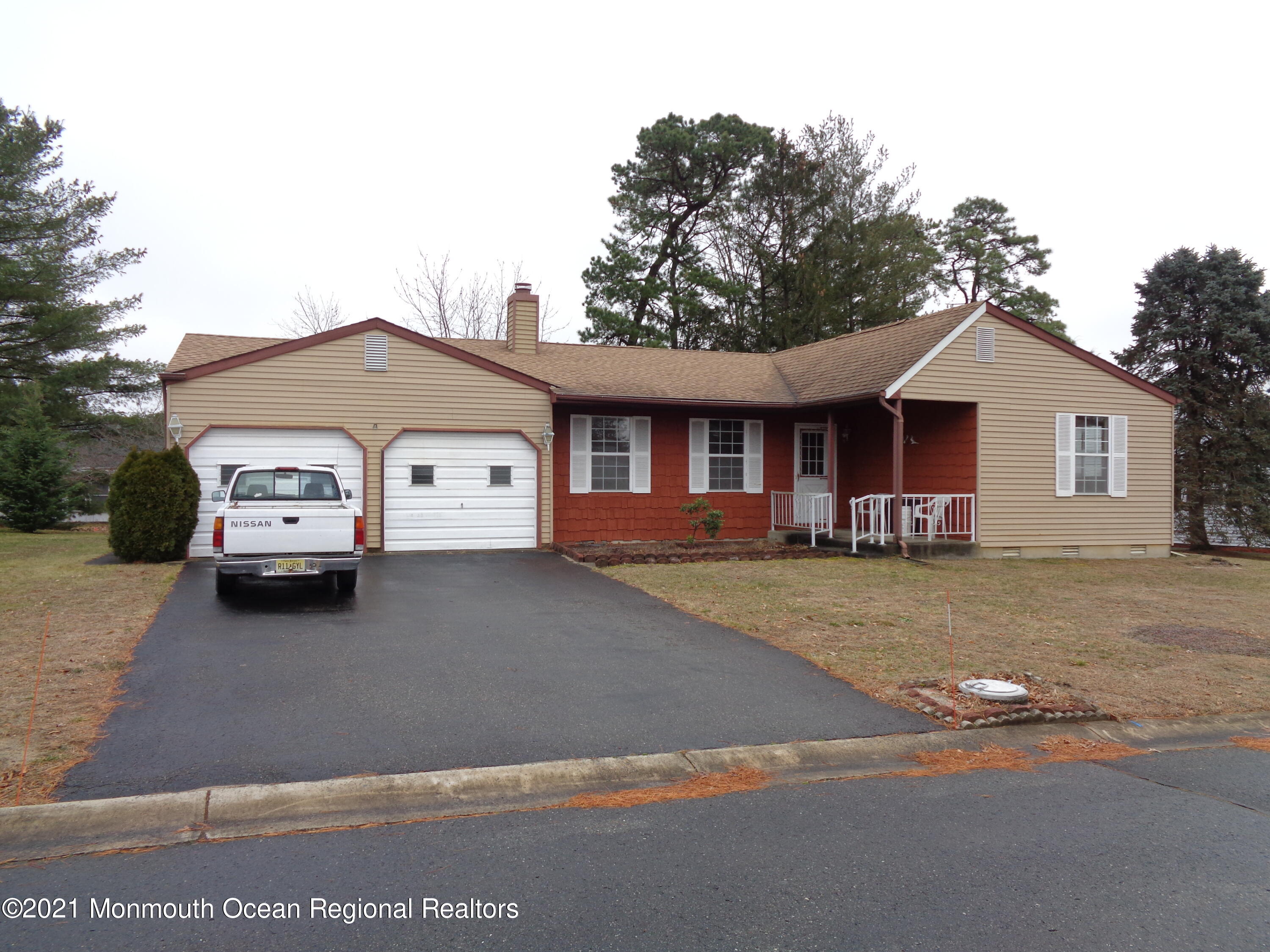 5 Amesbury Road Whiting, NJ 08759 - Photo 2 of 19 a white house covered with tall trees