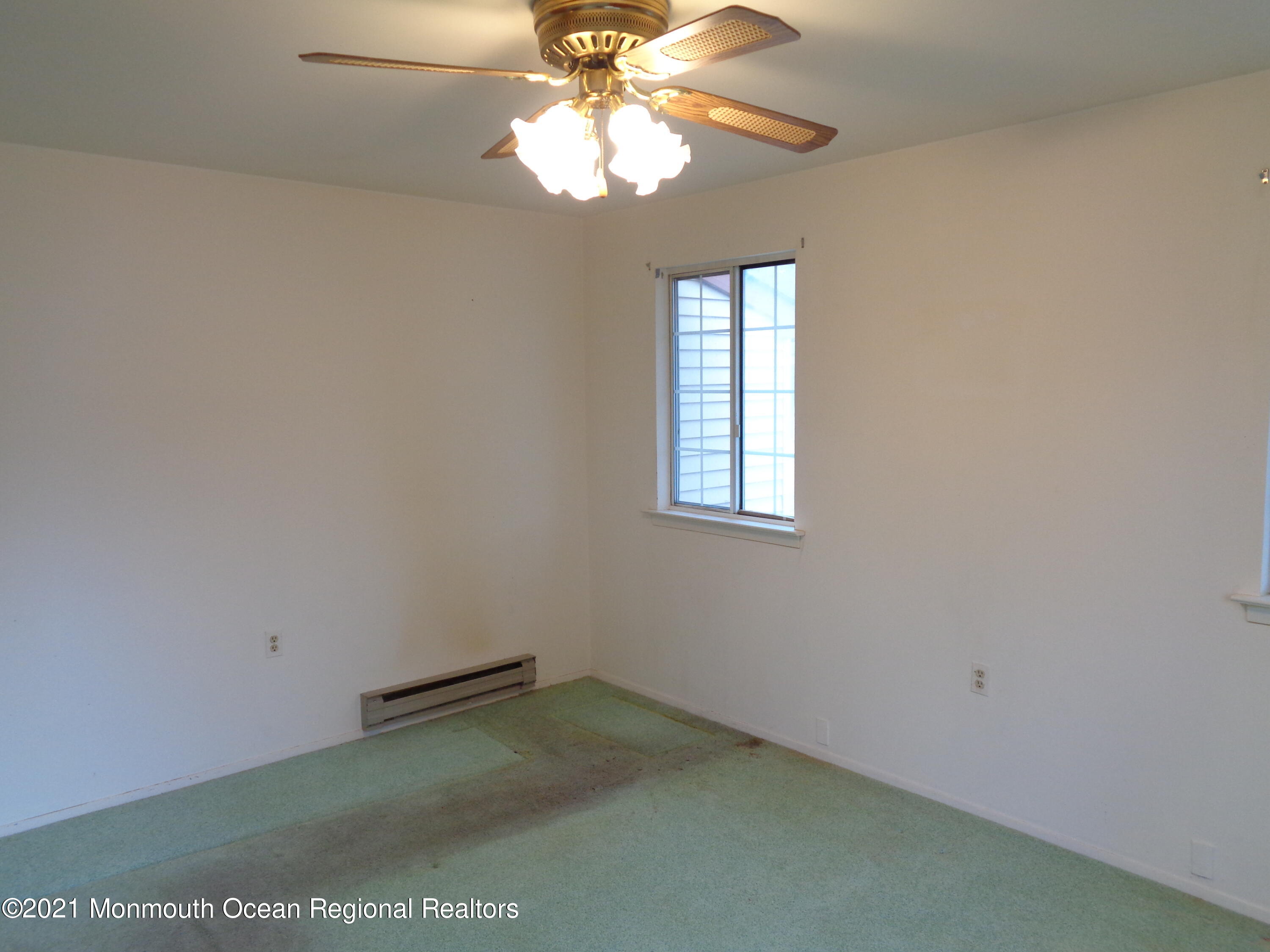 5 Amesbury Road Whiting, NJ 08759 - Photo 11 of 19 an empty room with windows and fan