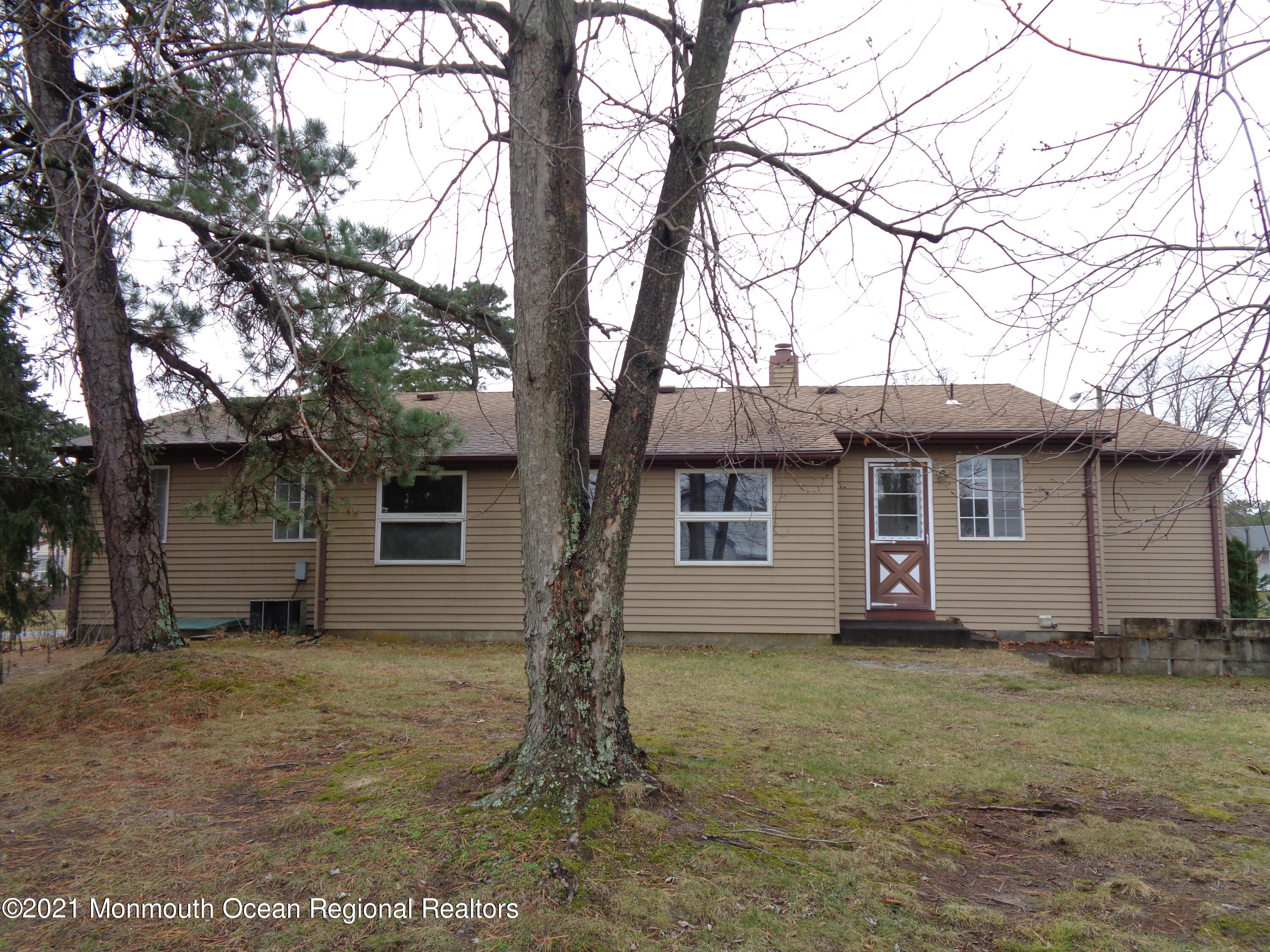 5 Amesbury Road Whiting, NJ 08759 - Photo 18 of 19 front view of house with a trees
