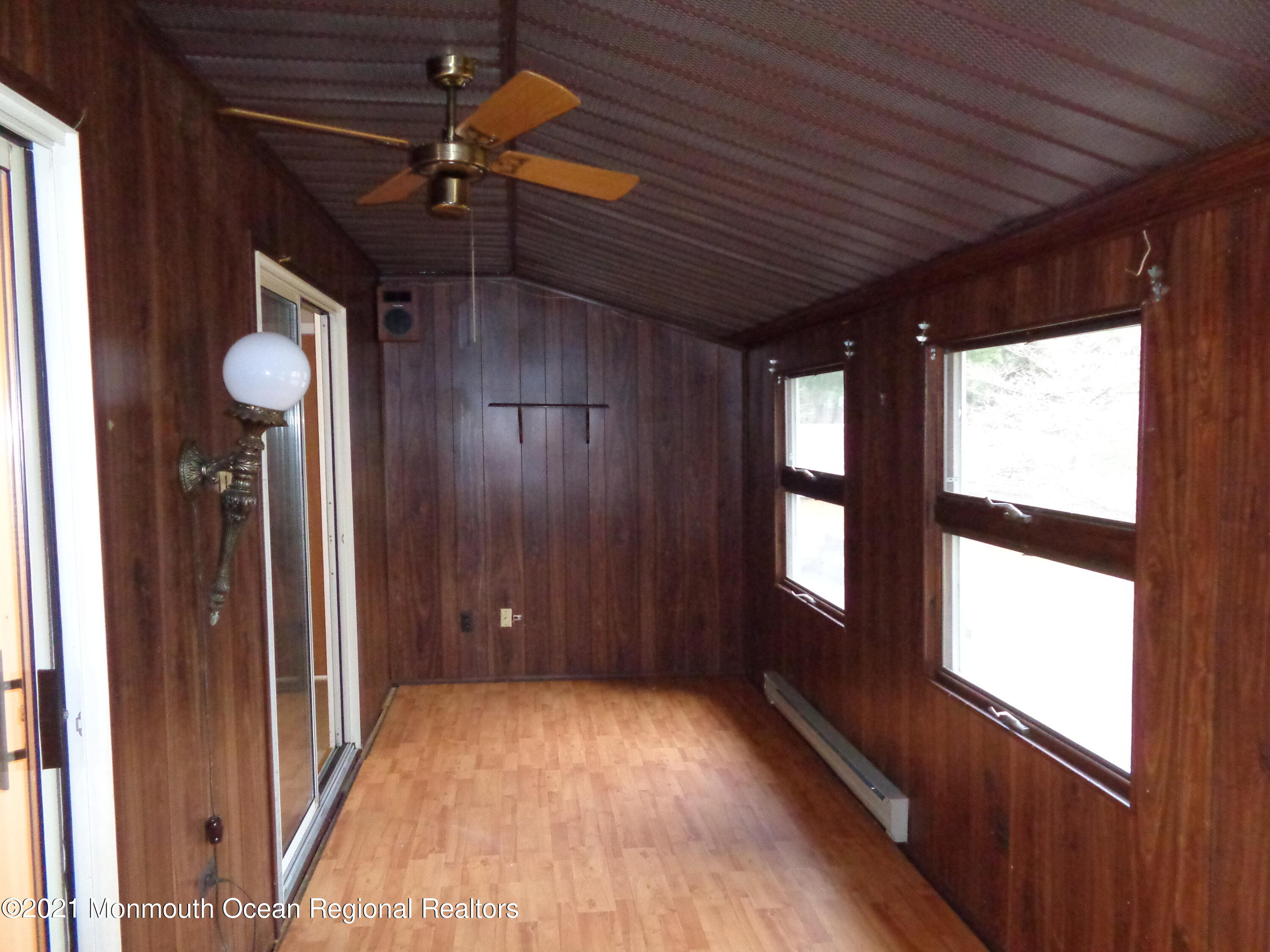 5 Amesbury Road Whiting, NJ 08759 - Photo 7 of 19 a view of an empty room with a window and wooden floor
