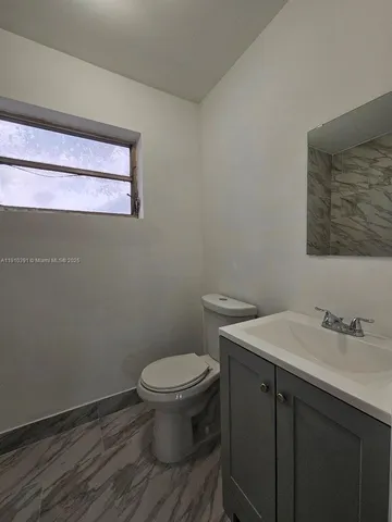 a bathroom with a sink and a toilet