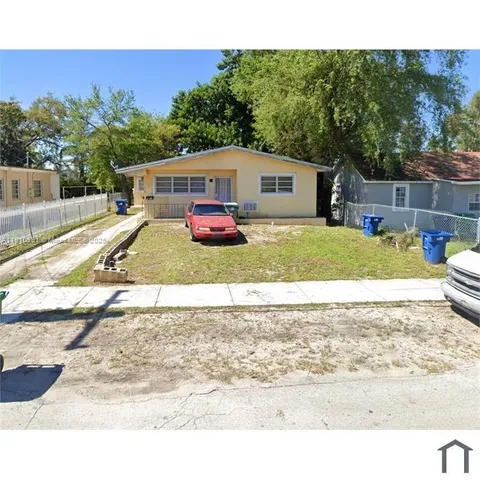 a house view with a backyard space