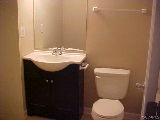 9305 Cason Road Glen Allen, VA 23060 - Photo 6 of 12 a bathroom with a sink toilet and a mirror