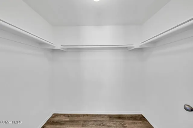 a view of a room with shelf on the wall