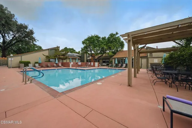 a view of a backyard with sitting area