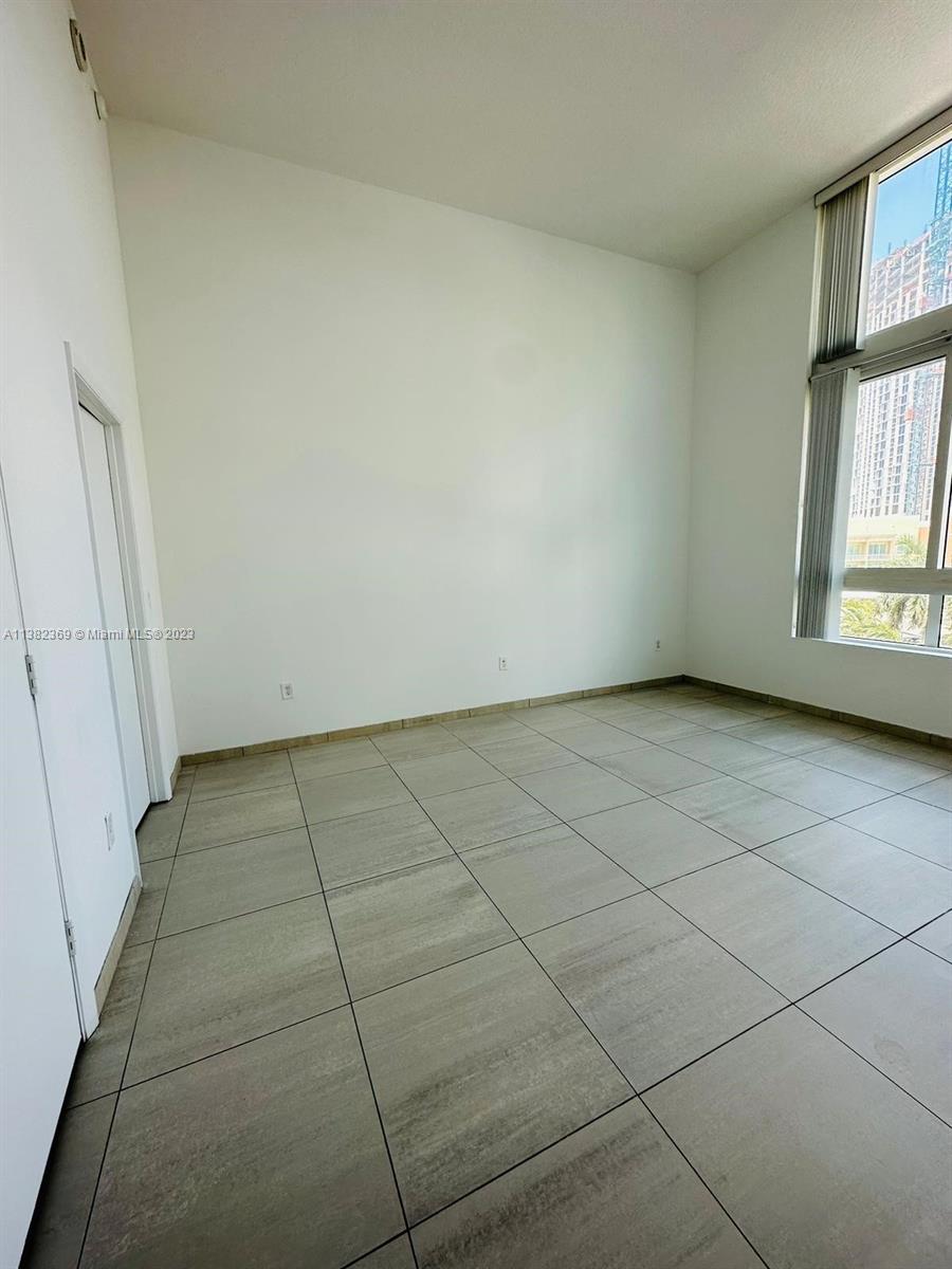 Edgewater Miami, FL 33132 - Photo 16 of 25 an empty room with windows