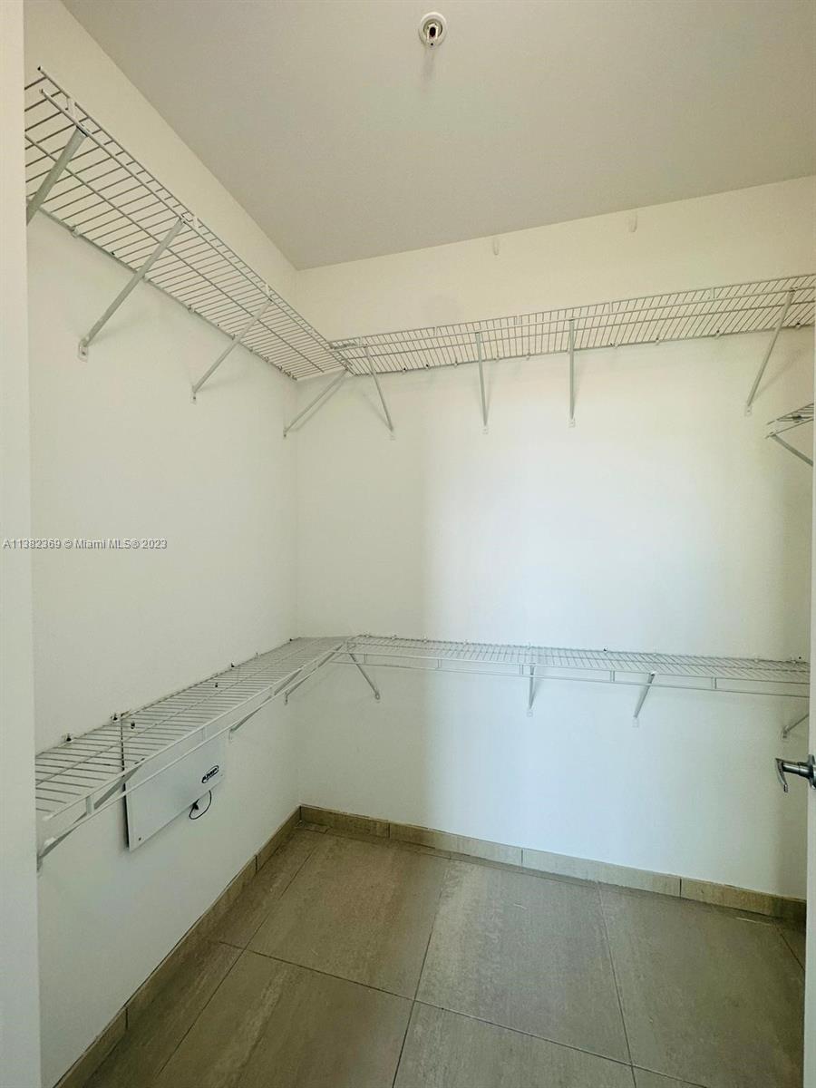 Edgewater Miami, FL 33132 - Photo 20 of 25 a view of a room with racks on the wall