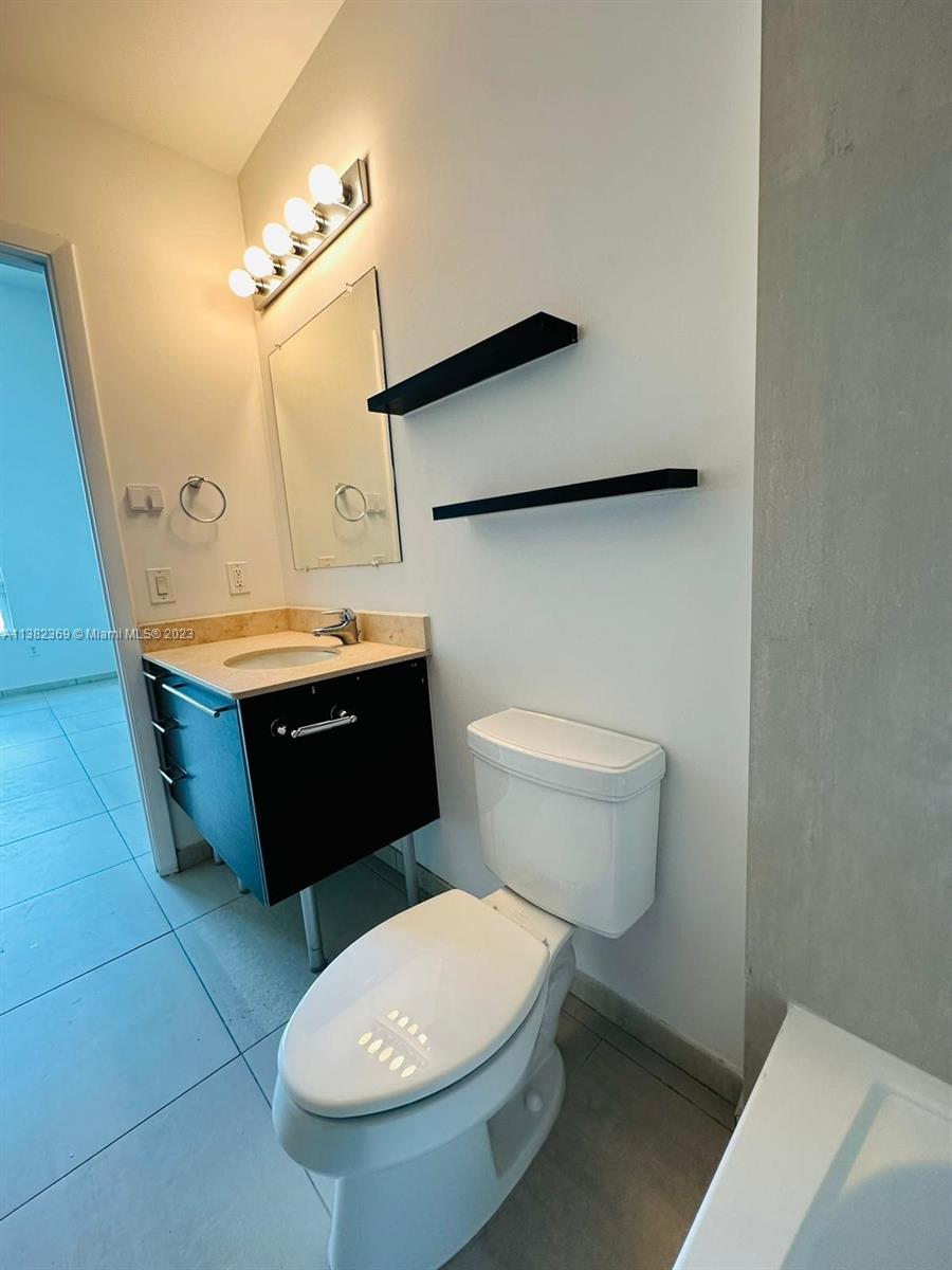 Edgewater Miami, FL 33132 - Photo 21 of 25 a bathroom with a toilet and a sink