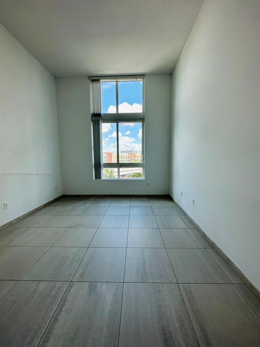 Edgewater Miami, FL 33132 - Photo 22 of 25 a view of an empty room with a window