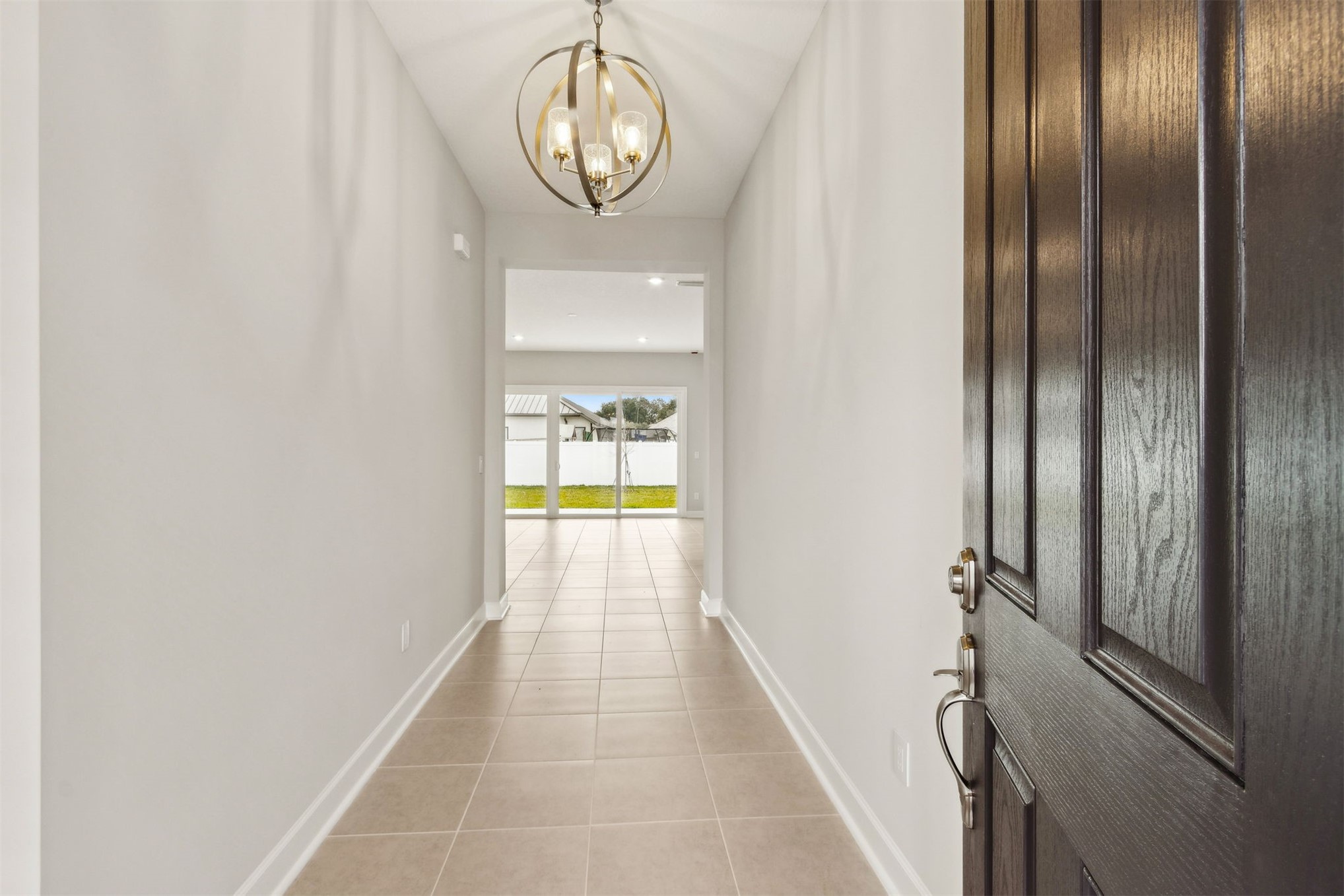 85236 Sandy Rdg Loop Yulee, FL 32097 - Photo 3 of 19 a view of a hallway with wooden shelves