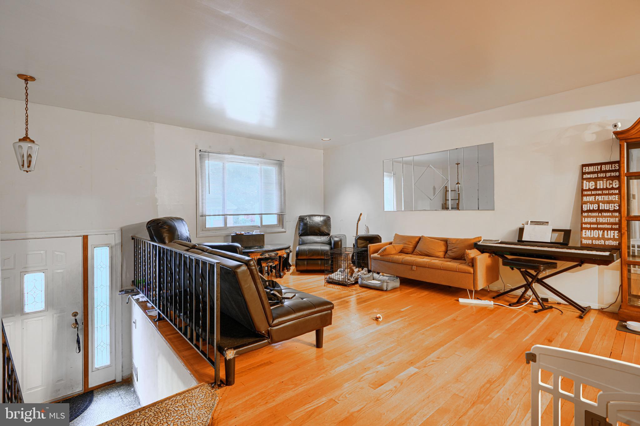3907 Roxanne Road Randallstown, MD 21133 - Photo 3 of 9 a living room with furniture and a wooden floor
