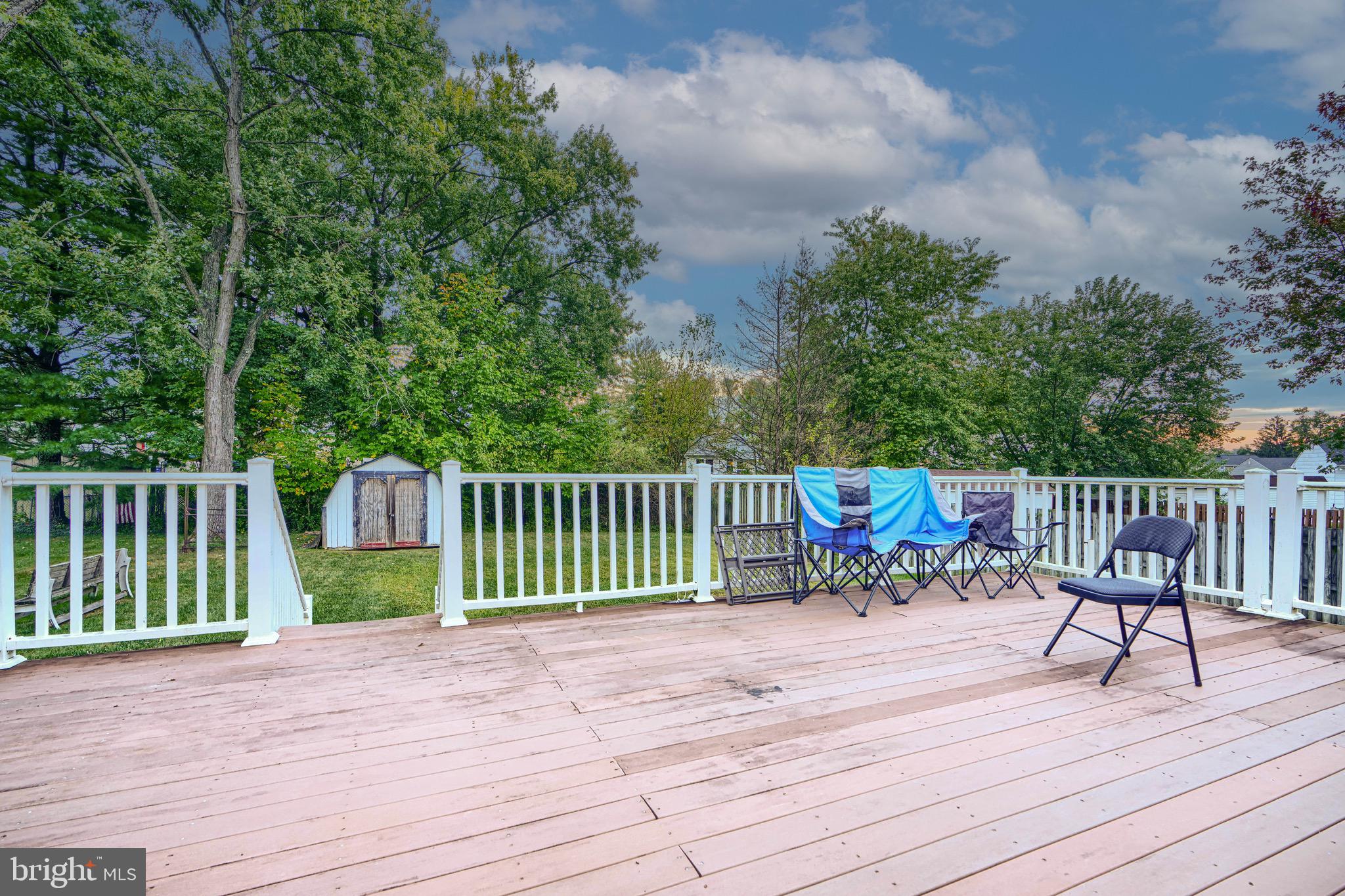 3907 Roxanne Road Randallstown, MD 21133 - Photo 7 of 9 a view of a wooden deck with a bench