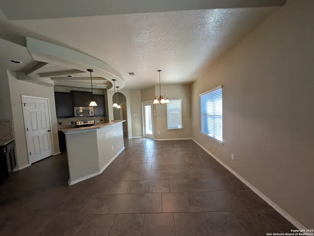 a view of a kitchen and window