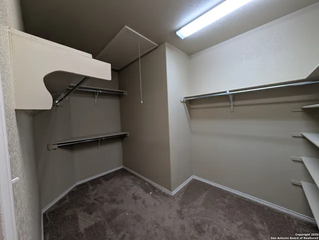 a view of a chairs and table in a patio