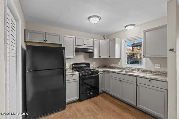 a kitchen with stainless steel appliances granite countertop white refrigerator stove a sink and dishwasher