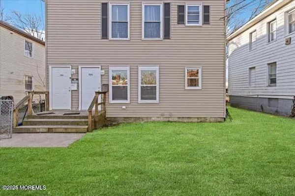 a view of front of house with a yard