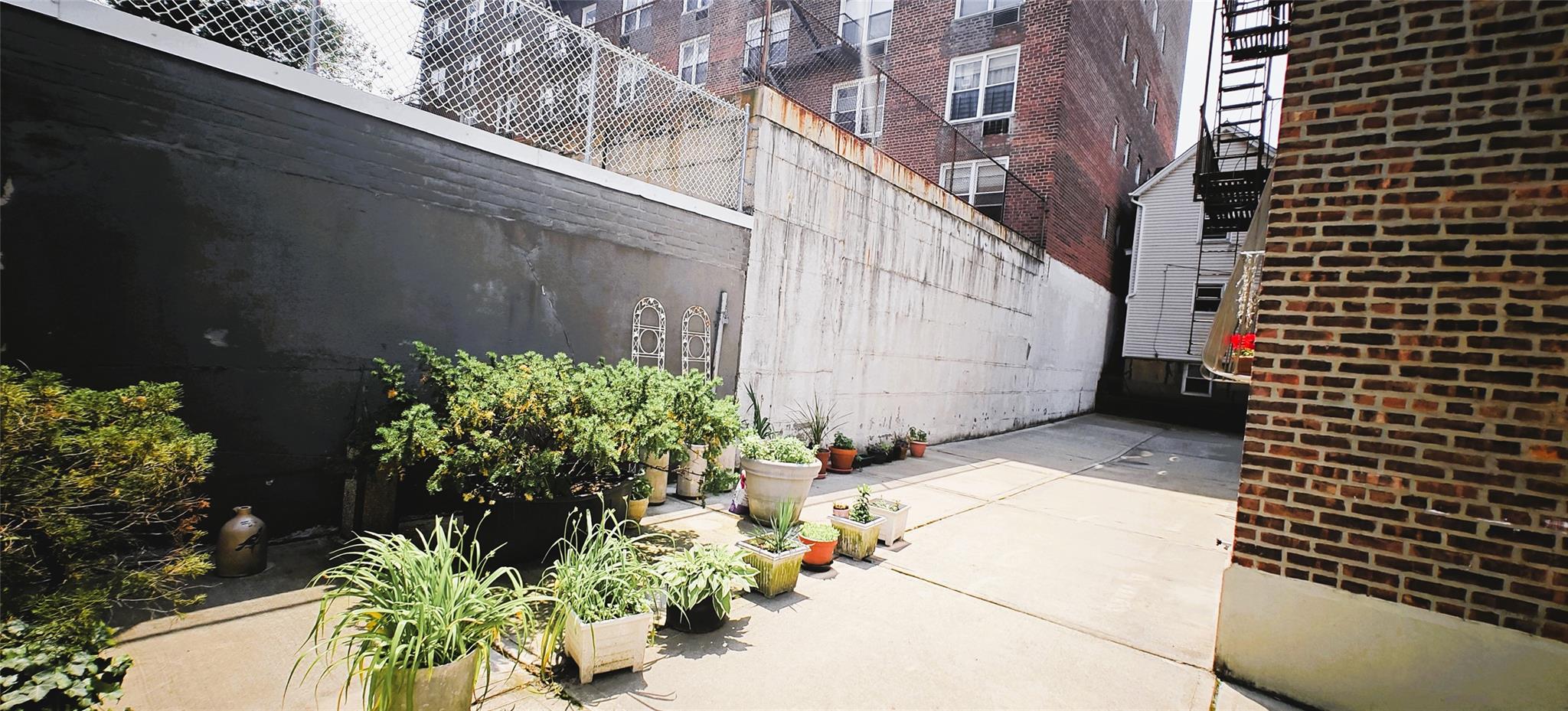 94-10 64th Road, Unit B6 Queens, NY 11374 - Photo 16 of 17 a view of a potted plants next to a wall