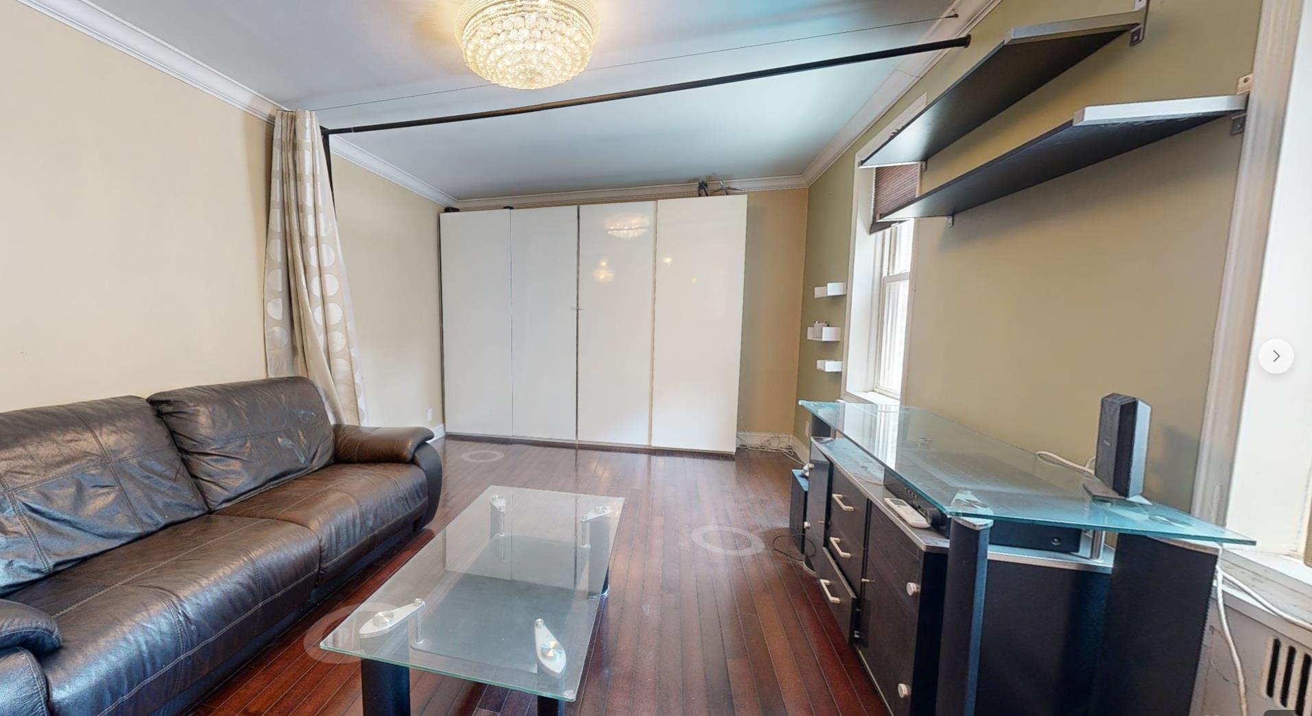 94-10 64th Road, Unit B6 Queens, NY 11374 - Photo 2 of 17 a living room with furniture and a window