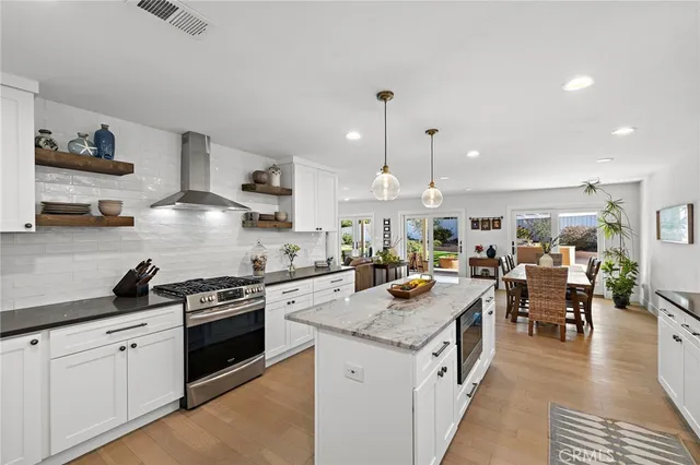 a kitchen with a stove oven and cabinets