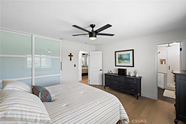 a bedroom with a bed and a dresser