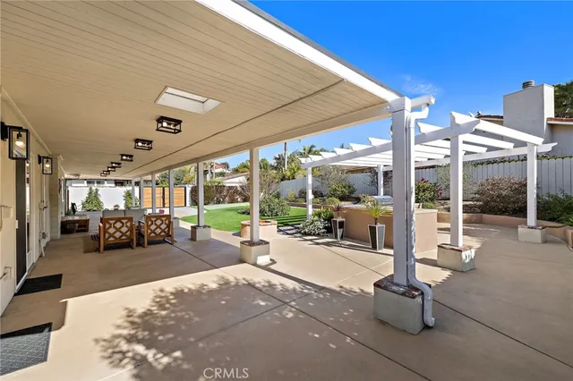 a lobby with furniture and floor to ceiling window