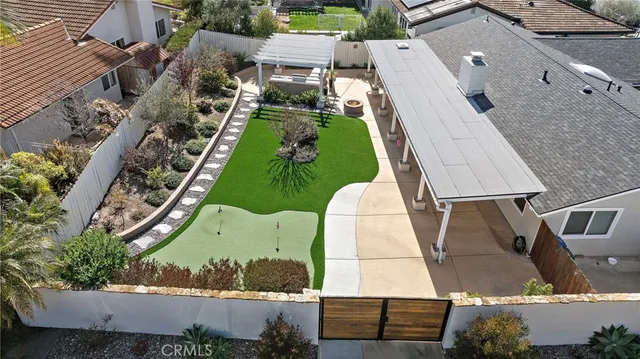 an aerial view of house with a yard