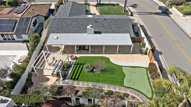 an aerial view of a house with a garden and plants
