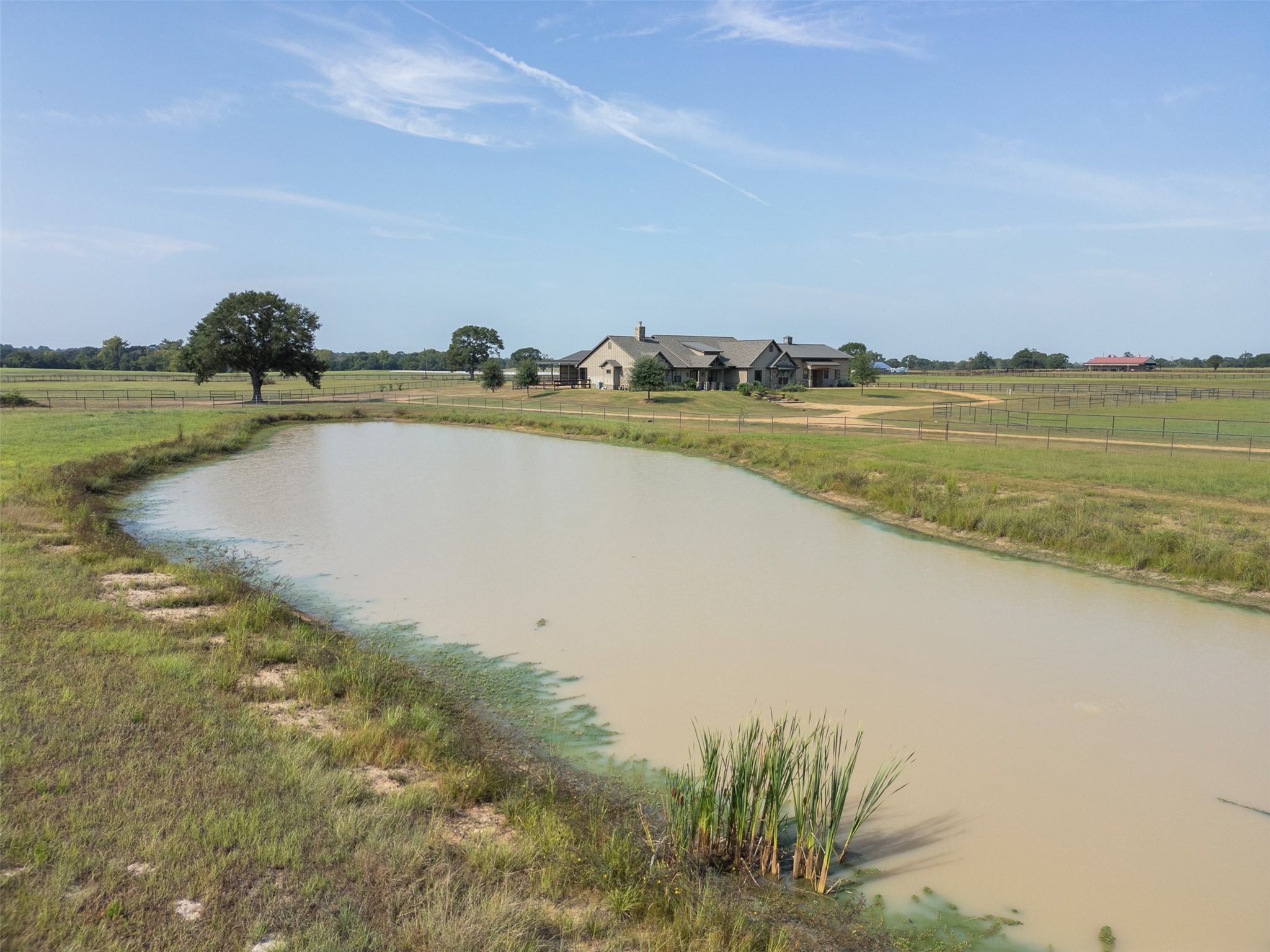 30163 High Spirit Ranch Road Hempstead, TX 77445 - Photo 43 of 46 The large pasture with a pond is perfect for your lawn ornaments or farm animals.