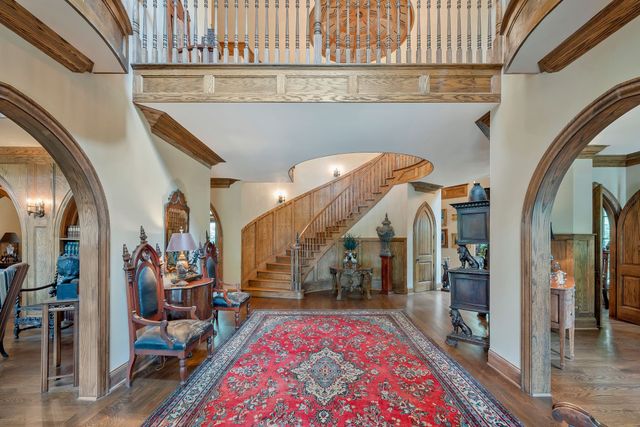 a bathroom with a granite countertop sink a mirror and a shower