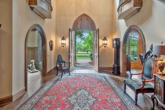 a living room with furniture a rug and a window