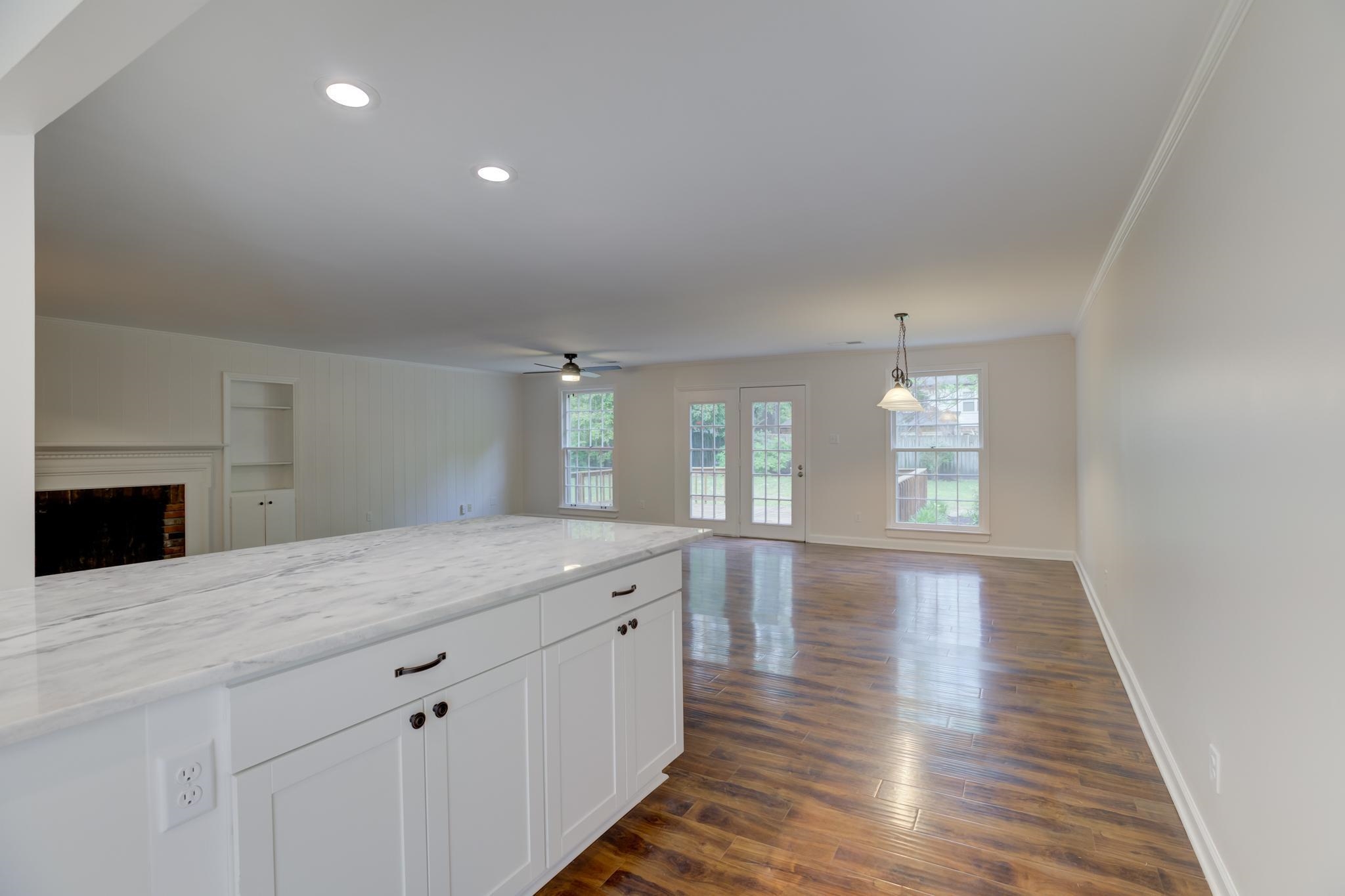 5170 Rich Road Memphis, TN 38117 - Photo 22 of 23 a view of kitchen and hall with wooden floor