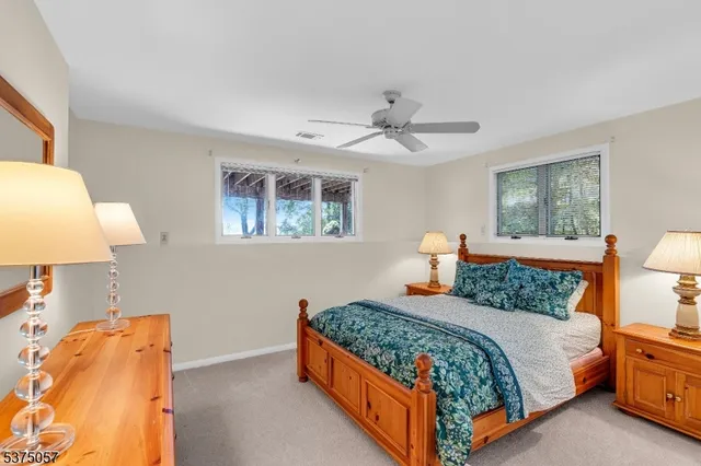 a bed room with a bed and a night stand