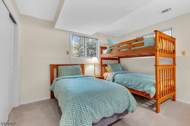 a front view of a house with a yard table and chairs